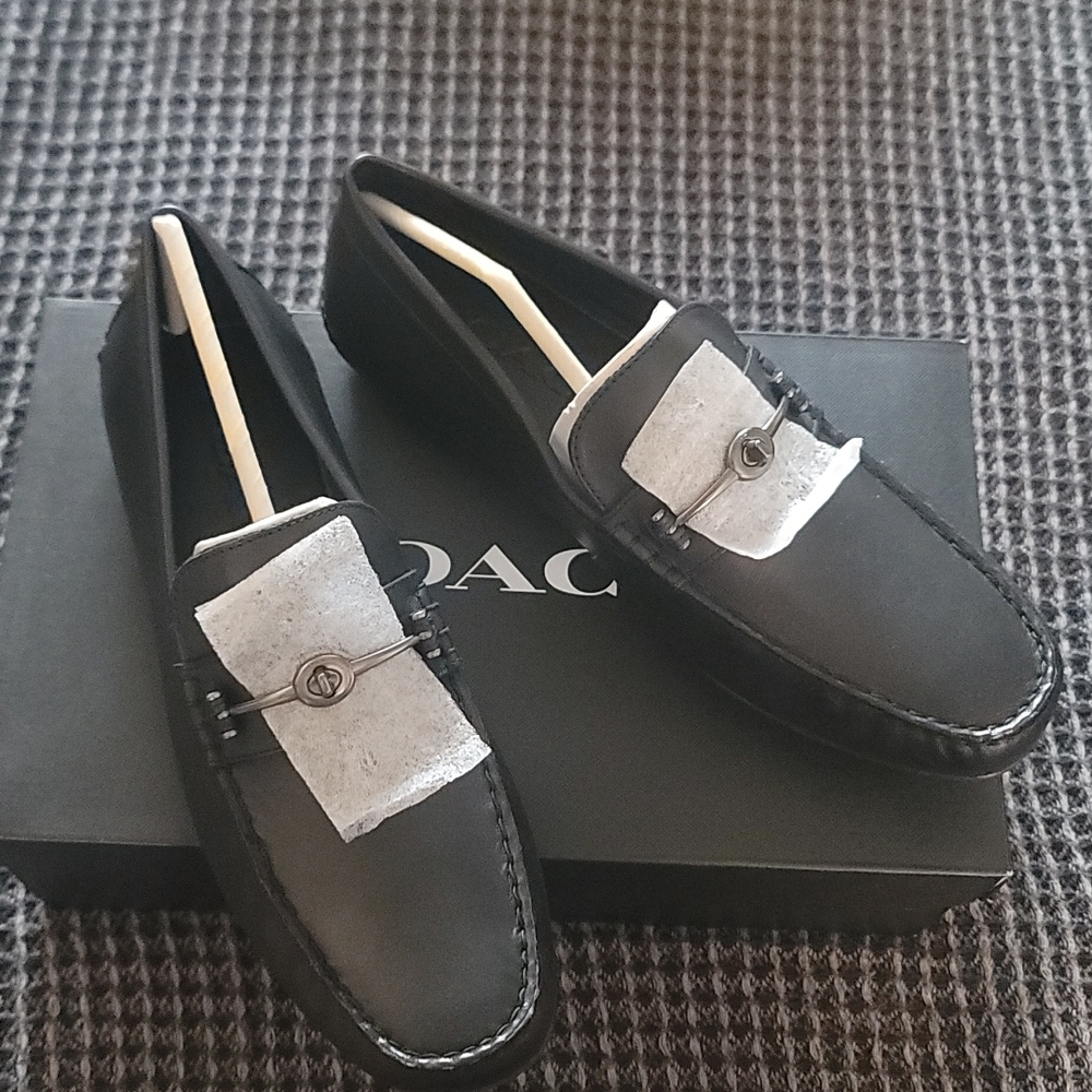Coach mott driver in black leather. With traditional hardware.